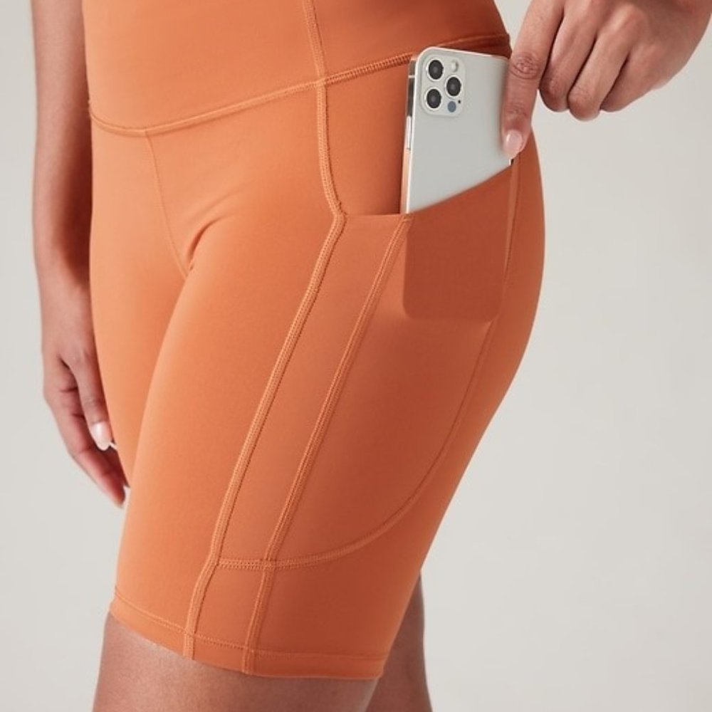 Athleta Orange Bike Shorts 7in